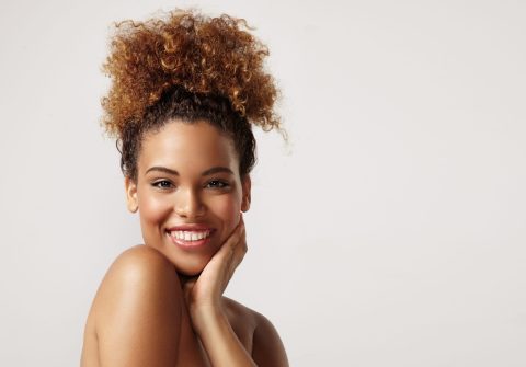 closeup portrait of a black woman with ideal skin