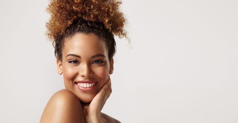closeup portrait of a black woman with ideal skin